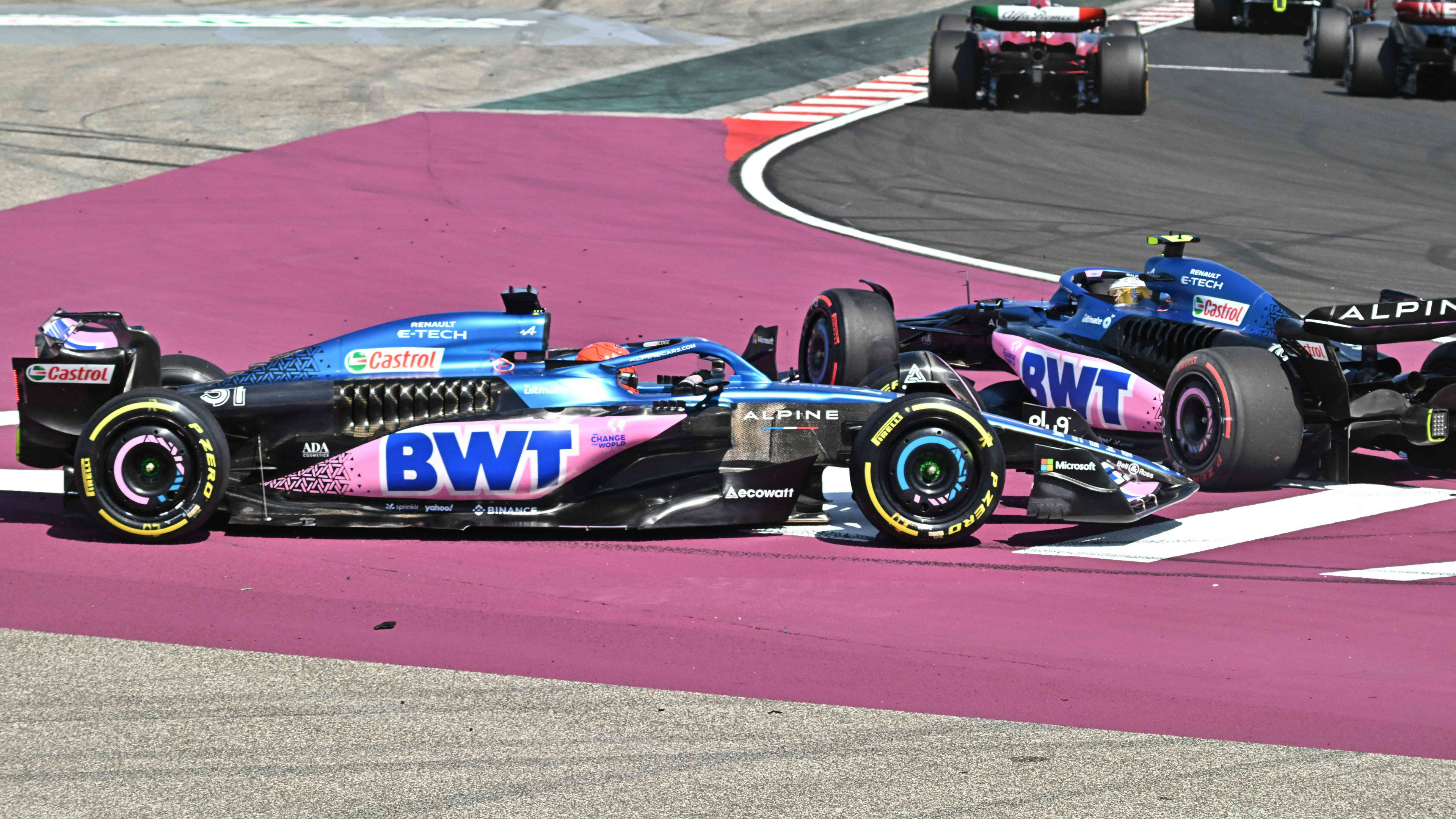 Alpines's French driver Pierre Gasly (R) and Alpine's French driver Esteban Ocon (L) collide as